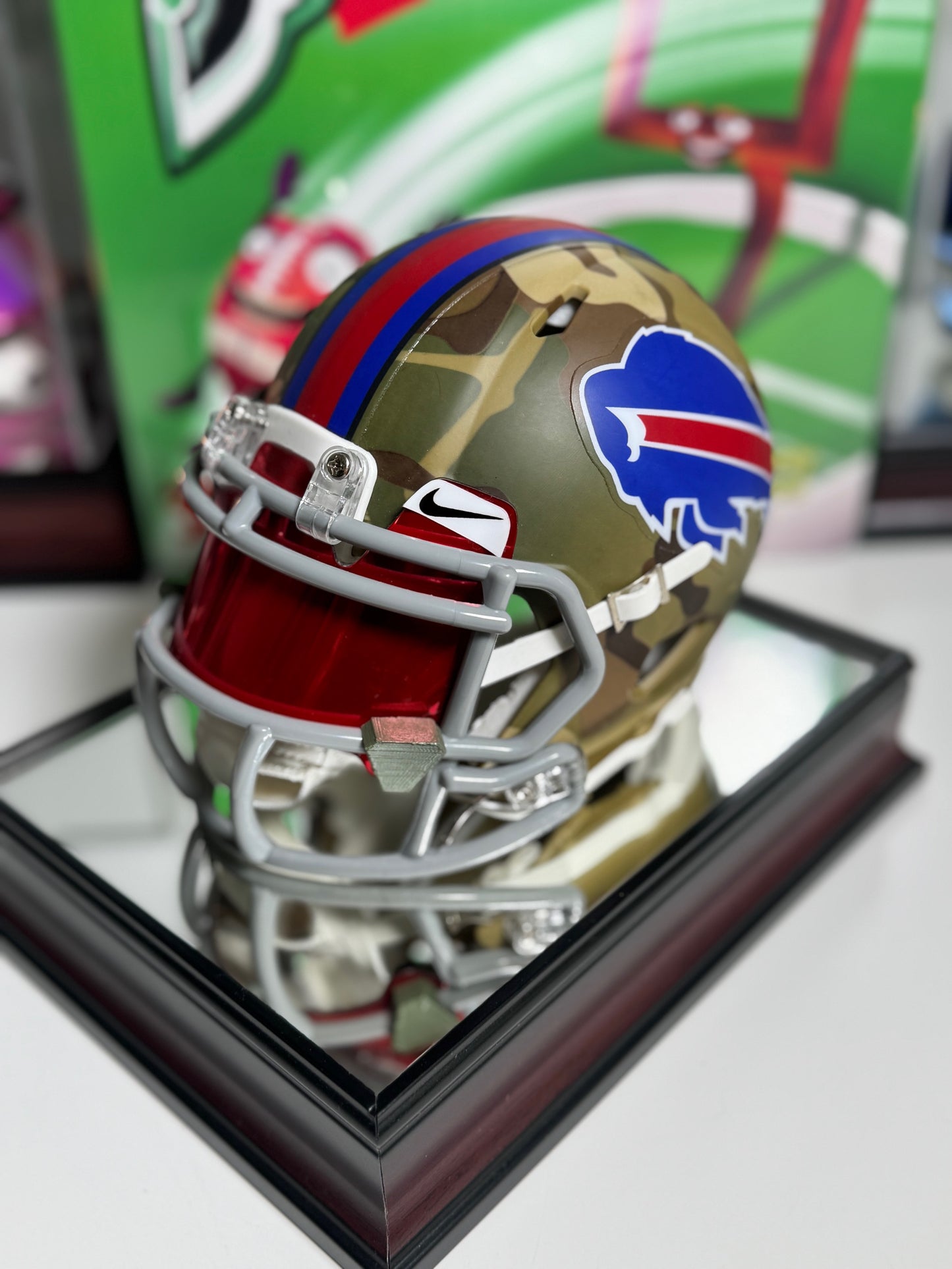 Back angle showing camo design and custom red and blue stripe on Jim Kelly signed helmet