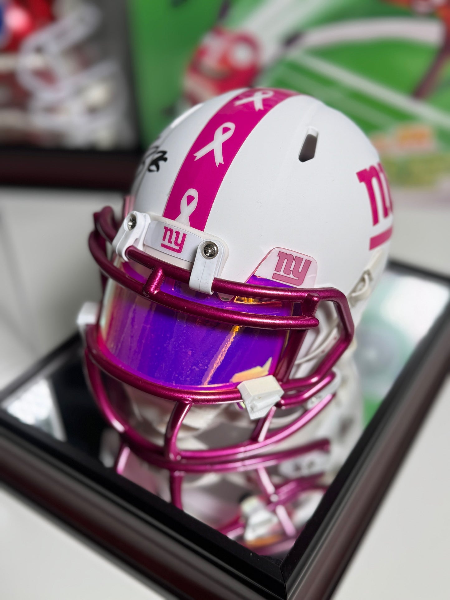Close-up of Saquon Barkley autograph on Breast Cancer Awareness mini helmet