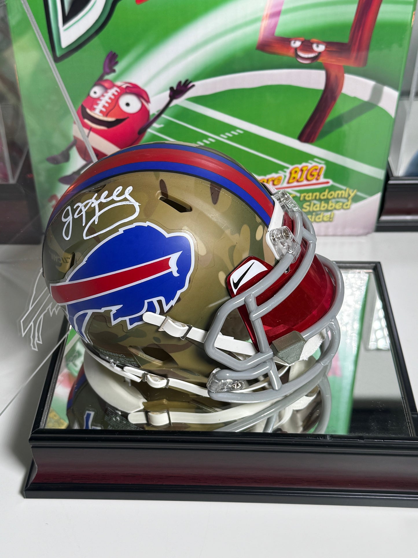 One-of-a-kind Jim Kelly signed camo mini helmet honoring military service and NFL legacy