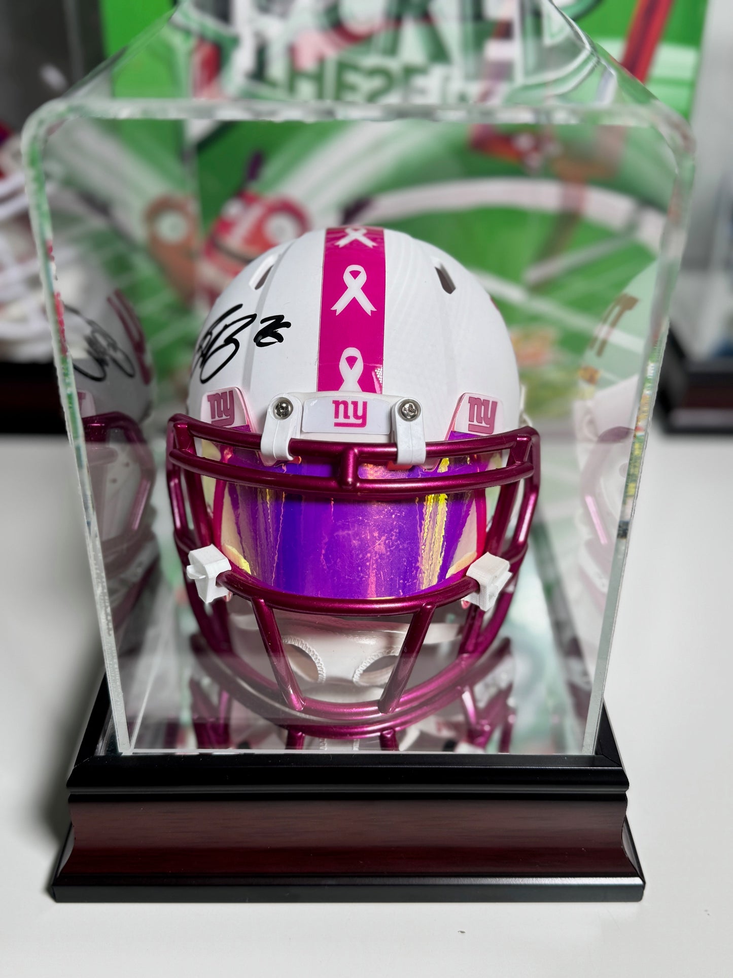 Saquon Barkley signature on pink NFL mini helmet honoring Breast Cancer Awareness