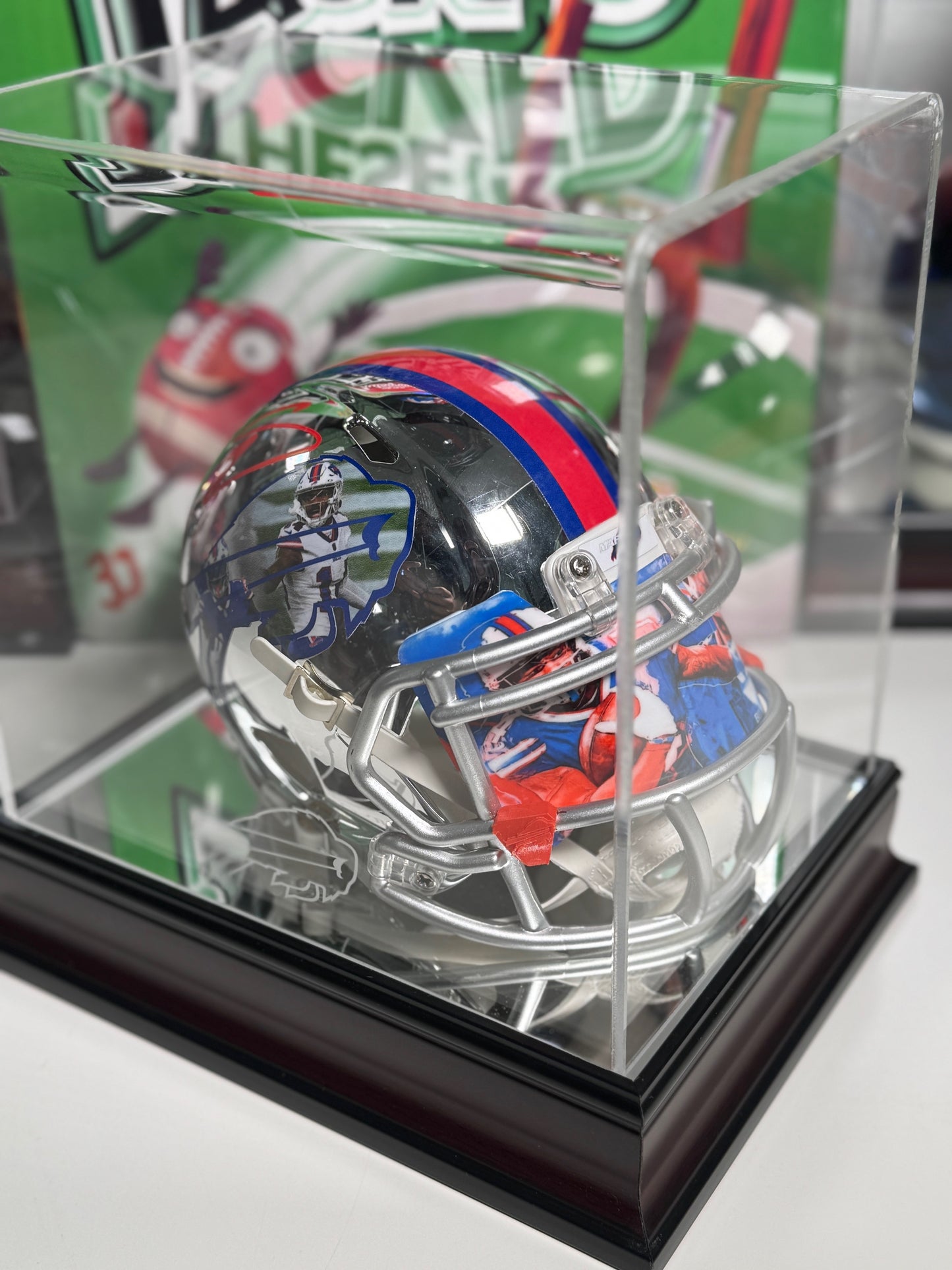 Close-up of Stefon Diggs autograph on chrome Bills mini helmet collectible