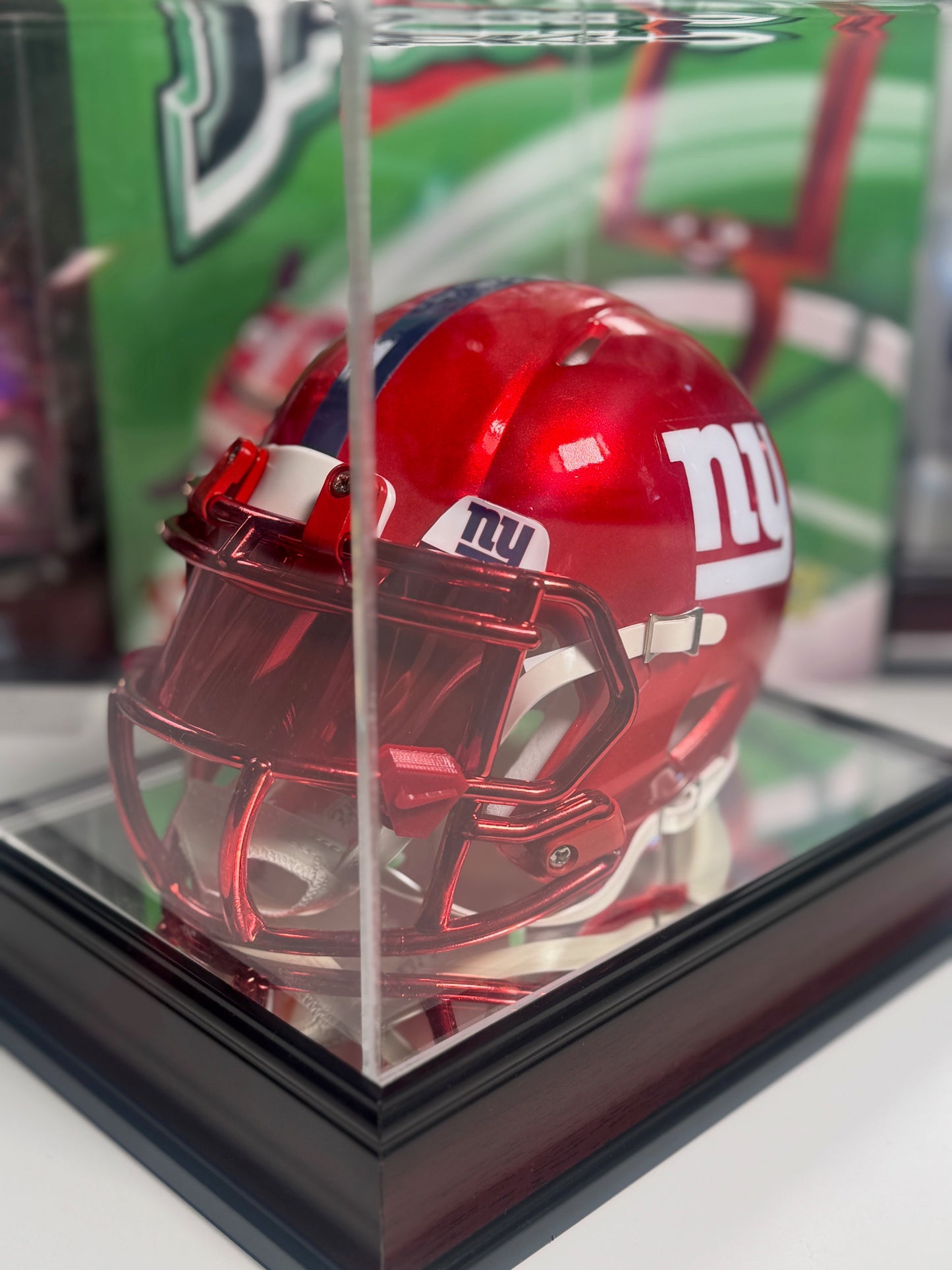 Fanatics display case housing Eli Manning signed Giants Flash mini helmet
