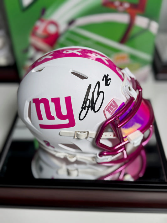 Saquon Barkley signed pink and white mini helmet with Beckett COA displayed in Fanatics case