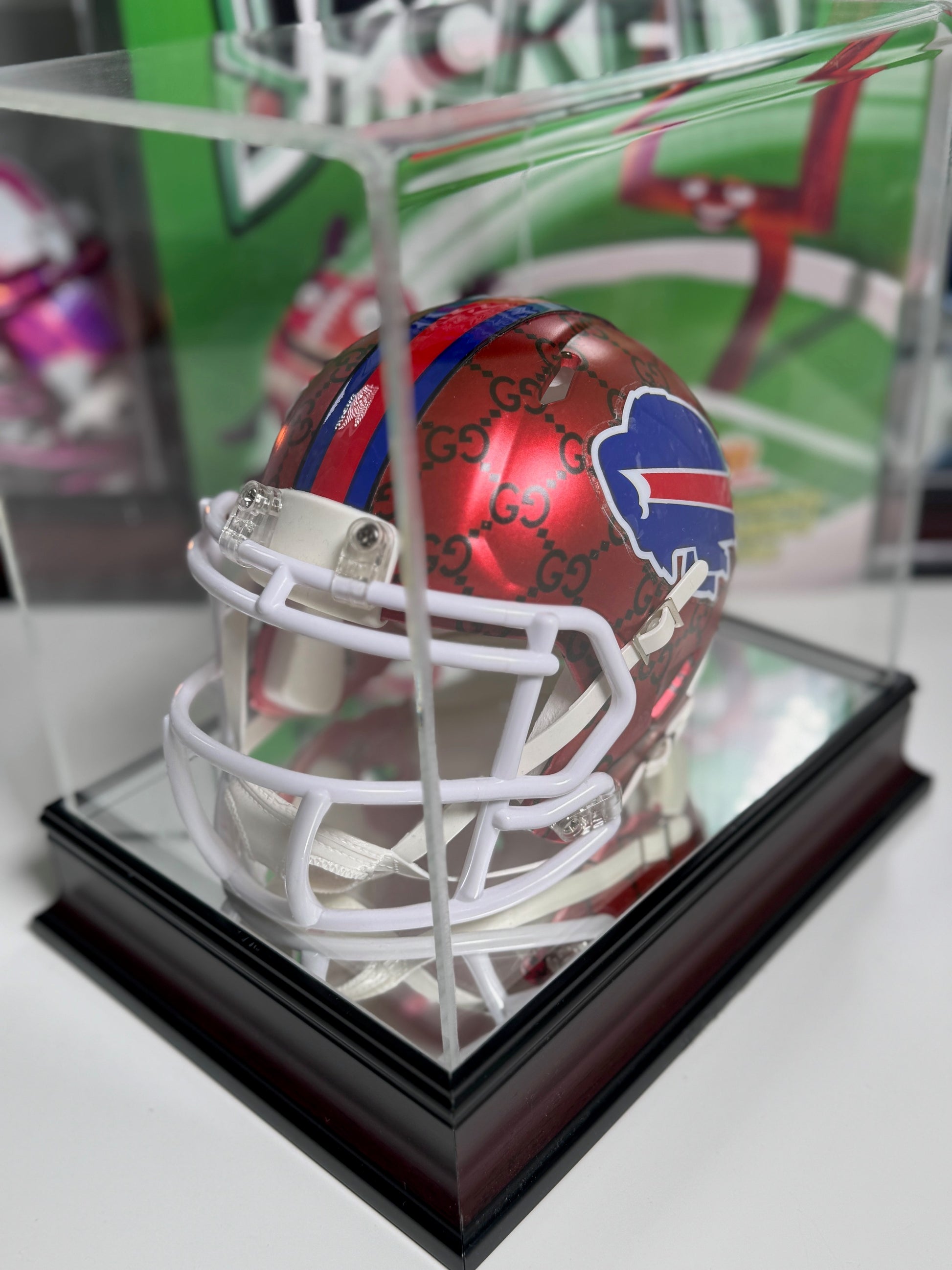Side view of custom Gucci mini helmet with red and blue stripe and black Gucci pattern


