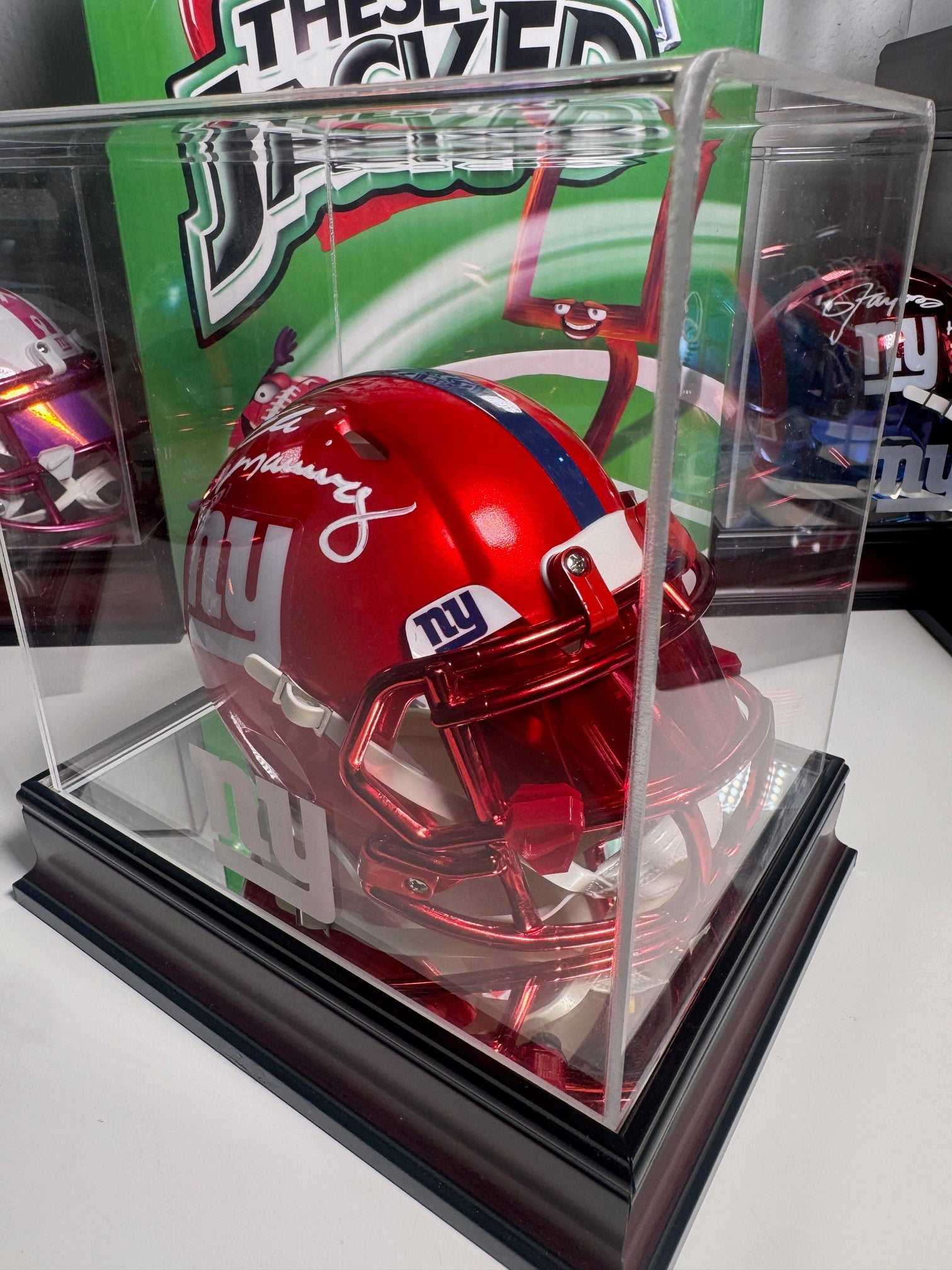 Top view of Eli Manning autographed red Flash mini helmet with authentication card